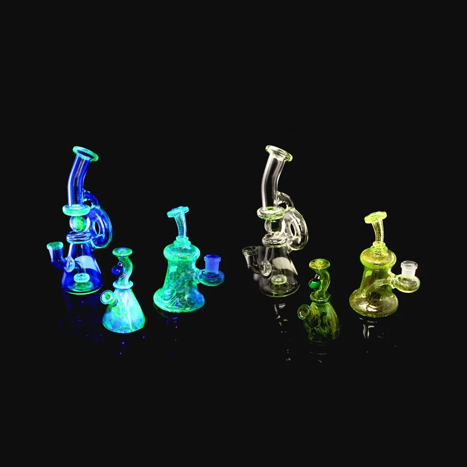 Five small glass rigs glowing blue, teal and yellow on black